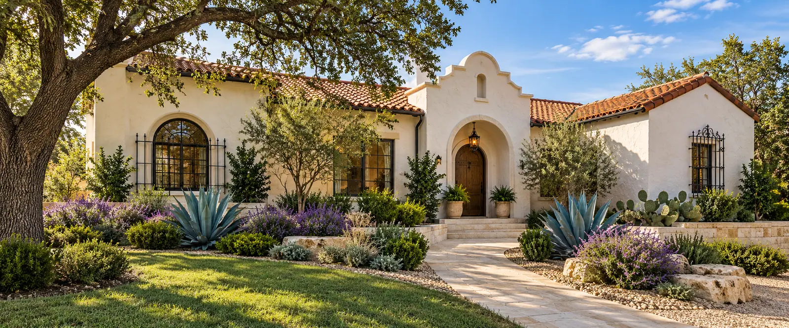 AI-generated ivory stucco Spanish Revival home with a red tile roof, arched entry, agave and Texas sage.
